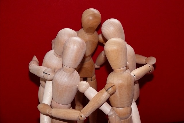 People made from wood hugging